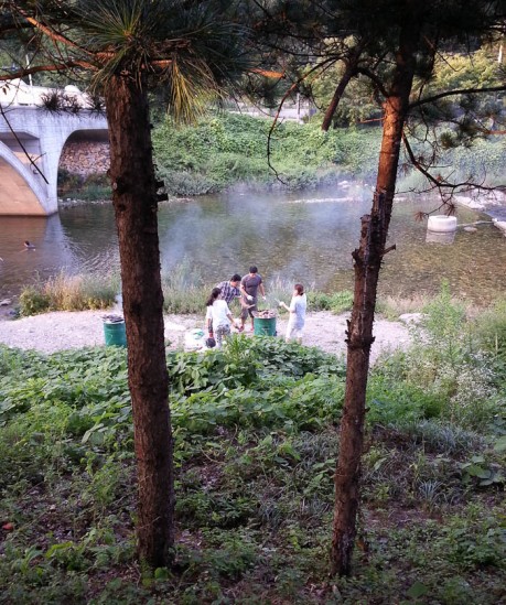 Dinner being prepared by the river.