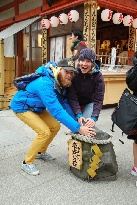Kinsey and Lars rubbing the rock for good relationship luck.